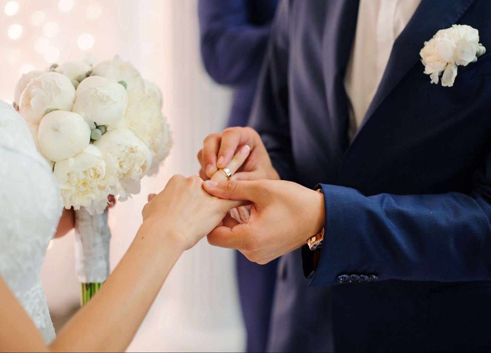 groom-puts-gold-wedding-ring-finger-bride-white-dress_130488-2461 تالار عروسی